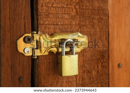 padlock installed on wooden door