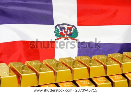 Row of shining golden bullions on the Dominican Republic flag background. Business and financial country reserves. Concept of gold reserve and gold fund of Dominican Republic