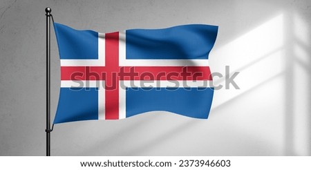 Iceland national flag cloth fabric waving on beautiful sky Background.