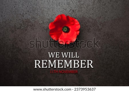 We Will Remember 11th November inscription with Poppy flower on rusty iron background. Decorative flower for Remembrance Day. Memorial Day. Veterans day. Royalty-Free Stock Photo #2373953637