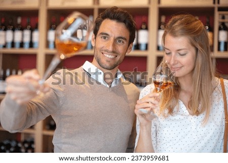 couple tasting a glass of  wine in traditional cellar Royalty-Free Stock Photo #2373959681