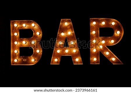 Luminous letters BAR. Volumetric letters from rusty metal with a garland of incandescent lamps