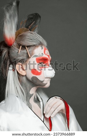 Halloween makeup and costume. Female face closeup