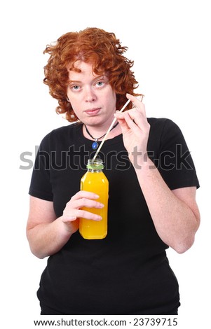 red head woman holding orange juice