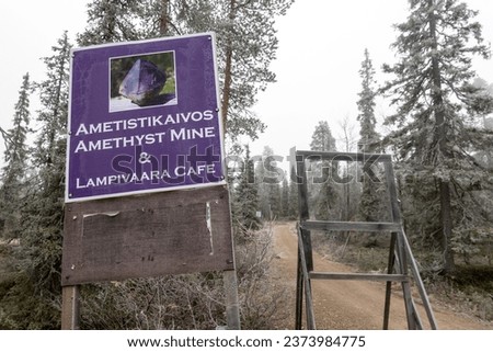 Lampivaara, Finland A sign on a hiking trail for the Amethyst mine and a local cafe.