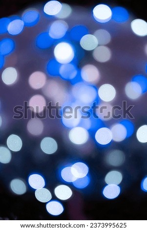 Blurred light halo, string light spot with black dark background at night.