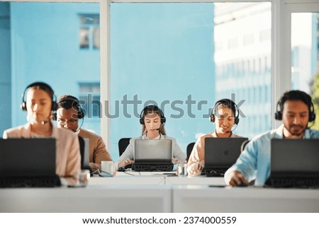 Woman, call center team and consulting at laptop in telemarketing, customer service or IT support in coworking agency. CRM group at computer for online questions, telecom advisory or FAQ at help desk Royalty-Free Stock Photo #2374000559