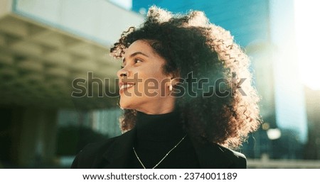 Face, thinking and wind with a business black woman in the city for growth, opportunity or inspiration. Idea, street and smile with a happy young employee looking around an urban town for vision Royalty-Free Stock Photo #2374001189