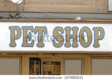 Pet shop store with a sign outside on a building facade