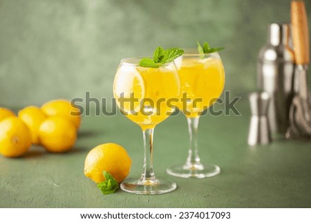 Homemade Limoncello spritz drink of liqueur, sparkling wine and lemon in cocktail glass Royalty-Free Stock Photo #2374017093