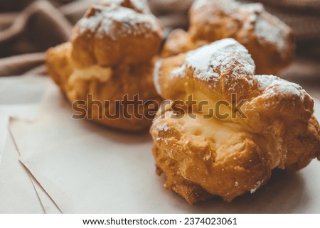 Freshly baked choux pastries close up.