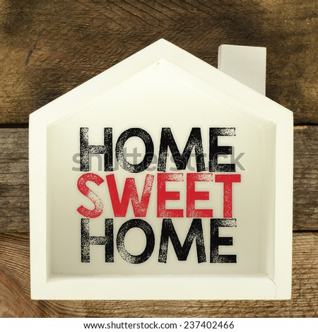 Home sweet home sign on rustic wood