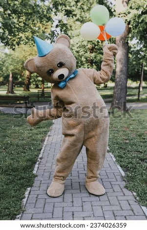 Teddy Bear Costume in park Royalty-Free Stock Photo #2374026359