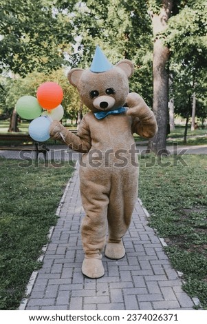 Teddy Bear Costume in park Royalty-Free Stock Photo #2374026371