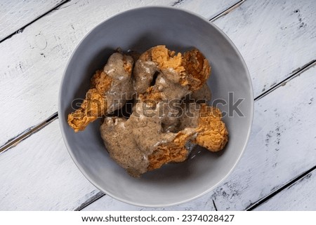 fried chicken wings with creamy  truffle sauce Royalty-Free Stock Photo #2374028427