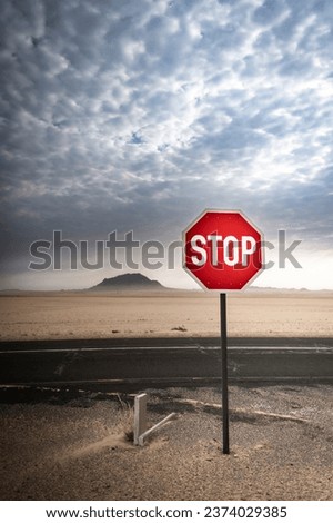 A red stop sign stands out against the background in the desert near Luderitz in Namibia