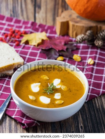 pumpkin soup. on a wooden background. gourmet. lunch .season