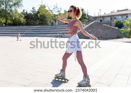 Young woman inline skating in a park