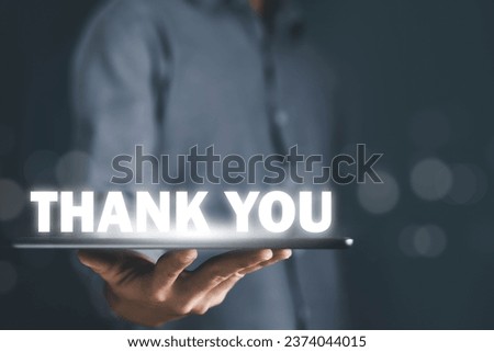 tablet shows the message thank you on a display screen. concept of thank you business, congratulations, and appreciation gratitude. presentation from technology digital Royalty-Free Stock Photo #2374044015