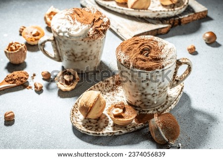 Hot chocolate with whipped cream and sweet cookies on a light background top view. place for text,