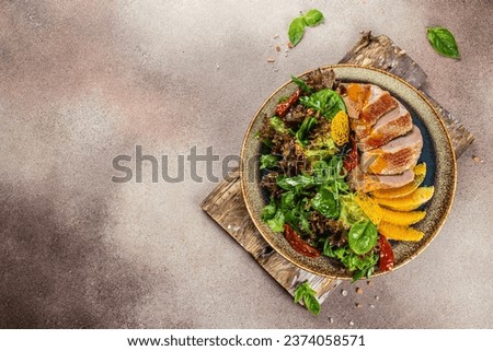 Roast duck breast with orange and greens. Restaurant menu, dieting, cookbook recipe top view.