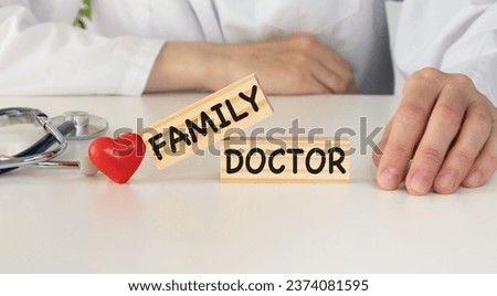 Concept of family medicine - red plastic red heart and stethoscope isolated on white background