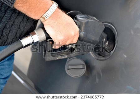 Pumping Gas - Concept of High Gas Prices
 Royalty-Free Stock Photo #2374085779