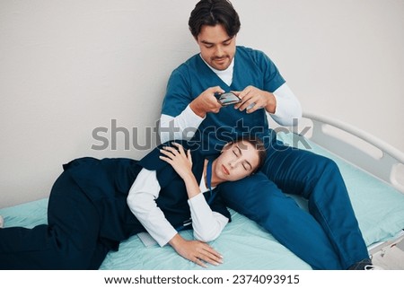 Doctors, friends and sleeping in picture for social median phone in clinic, joke and silly or goofy. Medical professionals, fun and comedy on break, tired and fatigue from work, hospital bed and rest