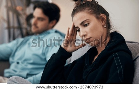 Frustrated couple, headache and fight on sofa in divorce, disagreement or conflict in living room at home. Man and woman in toxic relationship, cheating affair or dispute on lounge couch at house Royalty-Free Stock Photo #2374093973