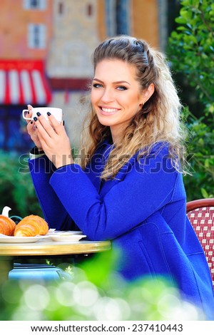 Morning with coffee and croissant at cafe. Beautiful woman at perfect morning!  Girl with good mood an shining smile !