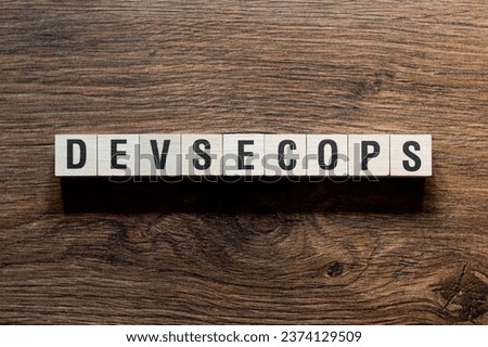 Devsecops - word concept on building blocks, text
