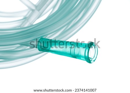Oxygen tubing hose with connector, component for controlled delivery of medical-grade oxygen, closeup isolated on white background Royalty-Free Stock Photo #2374141007