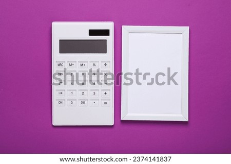 Calculator with frame on purple background