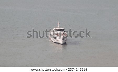 Fast ferry passenger vessel ship transportation sail at the sea. Royalty-Free Stock Photo #2374143369