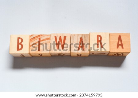 Wooden blocks make up the word "BIWARA" in English. Wooden block object