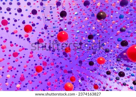 colorful wall with colored balls seen in perspective