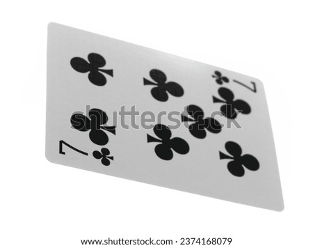 Flying playing card for poker and gambling, seven club isolated on white, clipping path