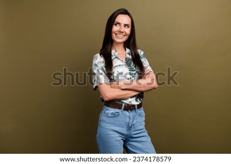 Portrait of funny curious office manager lady holding crossed arms looking side empty space isolated brown color background