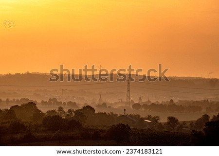 Electricity pylons of a transmission line at sunset