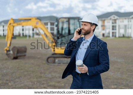 cheerful businessman construction investor outdoor. photo of businessman construction investor