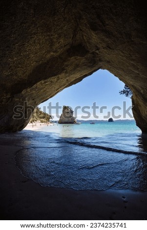 Empty beach at cathedral cove in New Zealand. Royalty-Free Stock Photo #2374235741