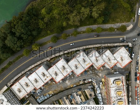 A top down view of a construction site of apartment buildings in Brooklyn, New York on a cloudy day. 