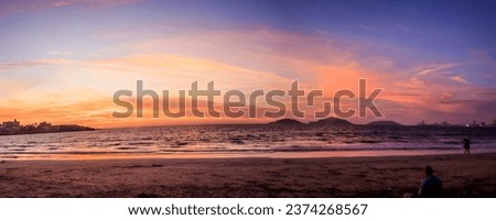 panoramic beach in Mazatlan at sunset, islands in the sea at sunset Royalty-Free Stock Photo #2374268567