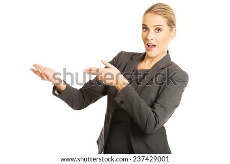 Business woman showing copy space.