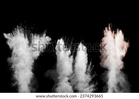 White talcume powder explosion on black background. White dust particles splash. Royalty-Free Stock Photo #2374293665