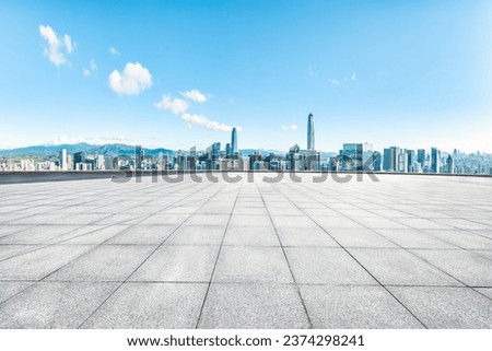Shenzhen clean square floor and city skyline with mountains background
