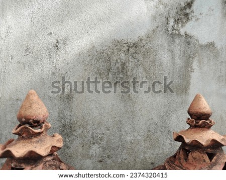 earthenware Used to decorate the front of the house tourist attraction With a cement wall, vintage style, abstract, natural background.
