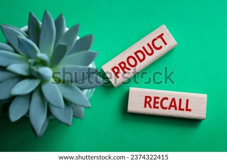 Product recall symbol. Concept words Product recall on wooden blocks. Beautiful green background with succulent plant. Business and Product recall concept. Copy space.