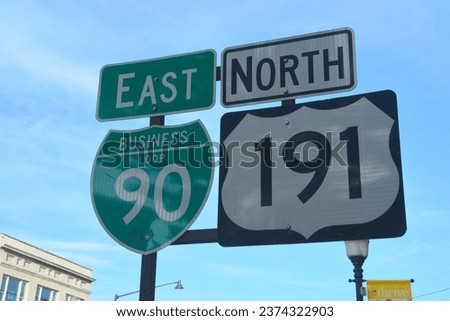 Horizontal image of a roadsign for Road 90 and 191 against a blue sky