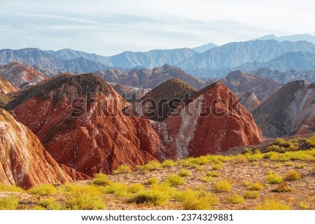 Colorful Danxia Topography during the golden hour, Zhangye, Gansu, China. Sunset picture with blue sky and copy space for text
